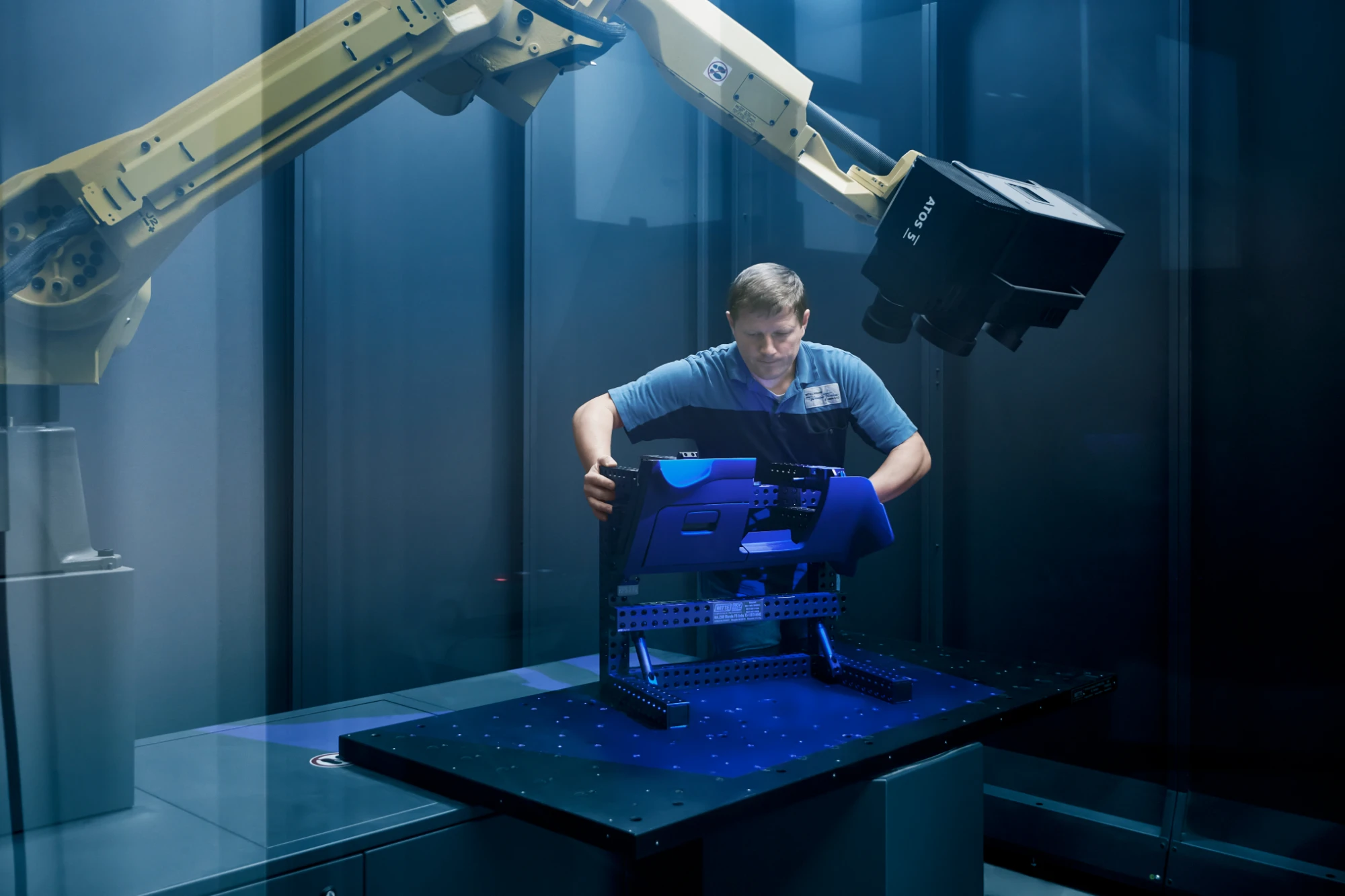 Automated ZEISS ScanBox optical 3D inspection cell scanning a part under blue light